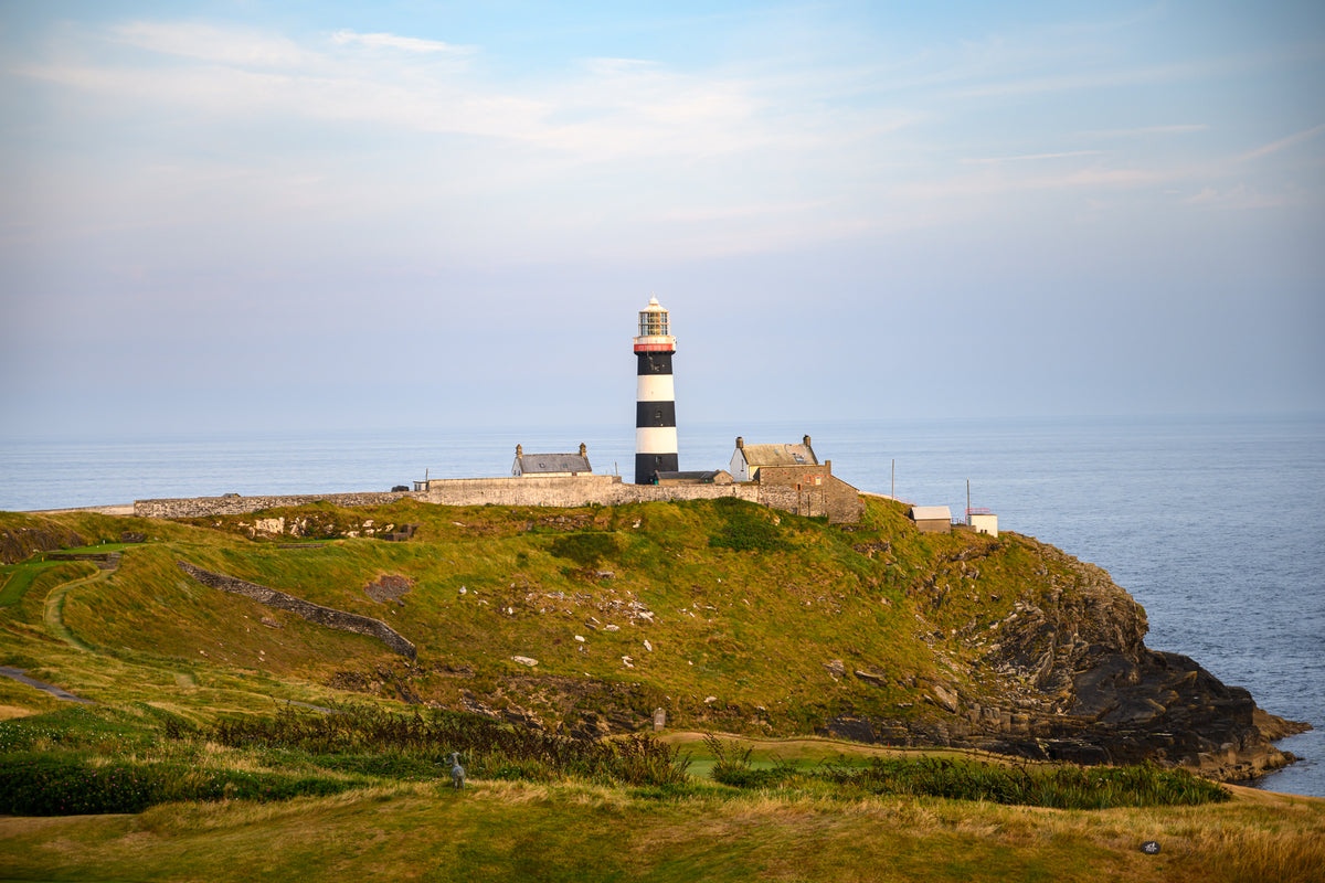 Old Head Lighthouse at sunset under acrylic glass with black frame